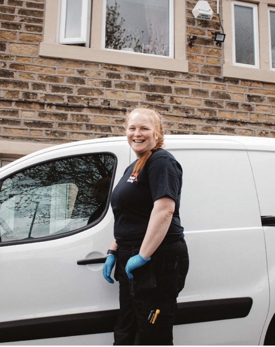Fay from Dolphin Heating with her van in Huddersfield